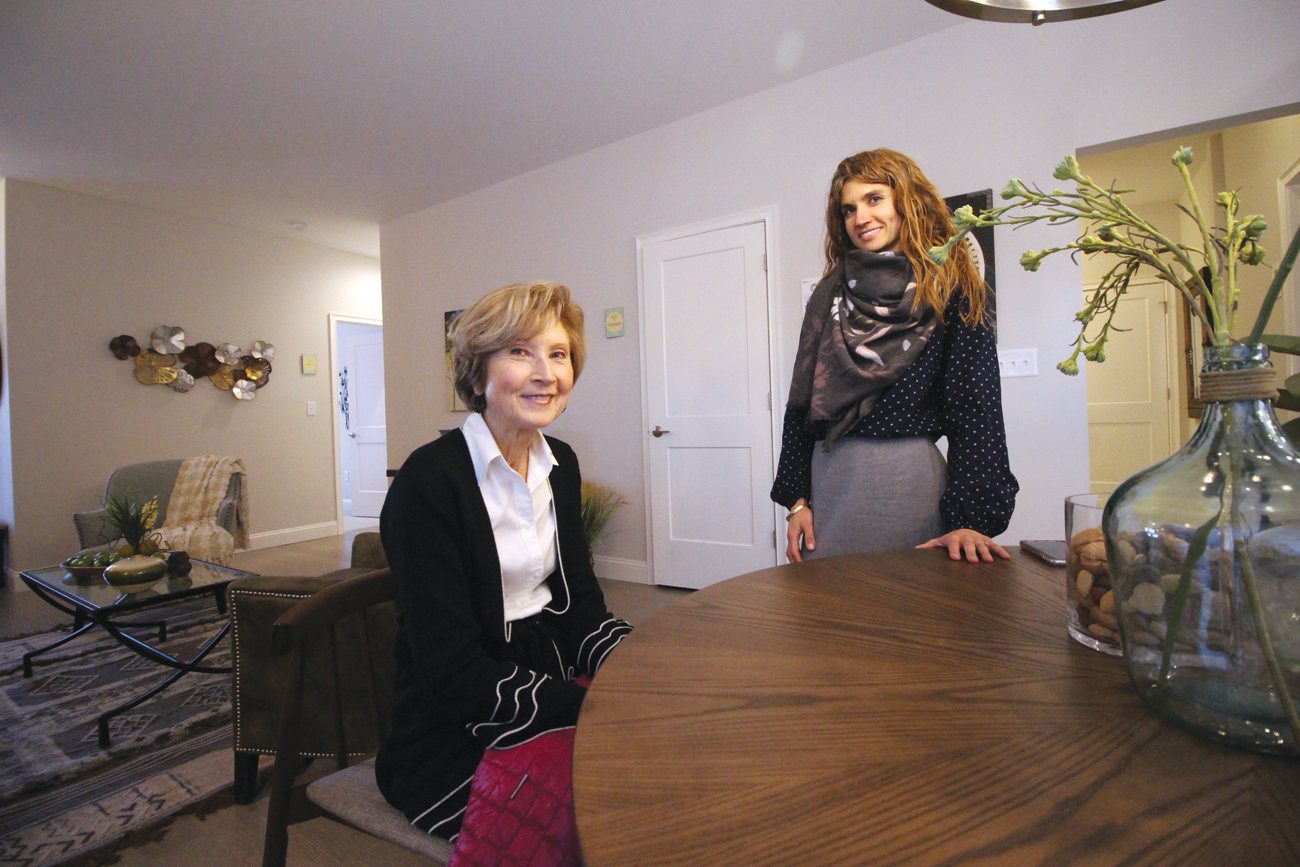 COMFORT AND EFFICIENCY: Vera and Sarah Fisher share a moment in the model home of the state’s Net Zero Energy residential development, located off Toll Gate Road not far from Interstate 95.